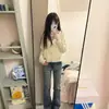 Jeans acampanados de tiro bajo de alta calle americanos para mujer, nuevo estilo de verano, diseño moderno, nicho, corte ajustado, versátiles, elásticos