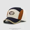 Gorra de pico de pato para niños de otoño e invierno, tela de secado rápido, bloques de color LUCKY, sombrero Lei Feng cálido para proteger los oídos, gorra de béisbol para niños y niñas