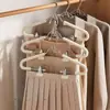 Novo cabide com prendedores para uso doméstico, uma ferramenta mágica para pendurar calças e saias no guarda-roupa, cabide com prendedor antiderrapante para saias, fácil de usar