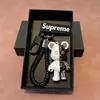 Llavero de coche de oso mecánico de alta gama de moda regalo personalizado para pareja muñeco tridimensional colgante de bolso pequeño regalo