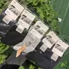 26 modelos de otoño e invierno al por mayor: Calcetines casuales de algodón para otoño e invierno, de longitud media para hombre y mujer, calcetines versátiles para hombre y mujer