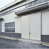 Puerta industrial corredera eléctrica, puerta corredera de doble hoja para instalaciones logísticas, puerta industrial corredera resistente al viento y aislada, producto de exportación no estándar