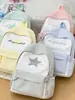 Mochila versátil de moda de verano 2026 transfronteriza, mochila estilo japonés para estudiantes de secundaria y preparatoria, ligera y de gran capacidad