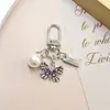 Nuevo de Moda Venta Caliente Transfronteriza Estilo Coreano Flor de Cinco Pétalos Niña Flor de Pera Colgante Llavero Accesorio Decoración para Bolsa Zouju