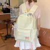 Mochila al por mayor estilo coreano estilo universitario versátil para ir al trabajo y a la escuela para mujer alta apariencia gran capacidad mochila casual escolar