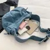 Nova bolsa transversal de jeans com alças largas, uma bolsa casual estilo bolinho para uso diário e para ir ao trabalho, com grande capacidade e uma única alça de ombro, 2026