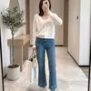 Producto de alta calidad: Pantalones de mezclilla Tencel de alta resistencia con bordado floral de 9 puntos en color azul brumoso, elásticos en cuatro direcciones, pierna recta adelgazante para principios de otoño