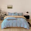 Nuevo modelo primavera y verano todo algodón estampado gofrado simple juego de casa de cuatro piezas dormitorio de estudiante tipo todo estación juego de tres piezas A 4