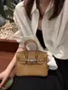 Bolso de alta calidad 2026 comercio exterior transfronterizo nuevo modelo piel de becerro togo platino, piel genuina, moderno y versátil, bolso de mano con colores contrastantes