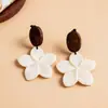 Brincos pingente flor de concha de agulha de prata transfronteiriços europeus e americanos, brincos estilo férias na praia, brincos de design nicho atacado