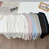 Nova camiseta fina de lã lyocell com ombros retos, gola redonda, corte slim e mangas compridas para primavera-outono feminina