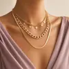 Collar con colgante de estrella multicapa con cadena de hueso de serpiente de metal sexy de moda transfronteriza europea y americana para mujer