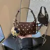 Bolso de axila tipo dumpling de lunares de nicho estilo coreano transfronterizo, bolso de hombro simple casual, bolso cruzado moderno, fresco y dulce