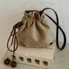 Bolso tipo cubo de alta gama, lujo ligero, vintage para mujer, nuevo modelo de otoño 2026, bolso de hombro de nicho para el día a día, bolso cruzado versátil