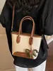 Bolso de mano tipo cubo nuevo de primavera 2026, transfronterizo, estilo vintage simple, de alta gama, moderno, para ir al trabajo, bolso de hombro cruzado de moda
