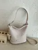 Bolso de axila tejido de patrón retro de nicho, bolso tipo cubo para mujer, nuevo bolso de hombro cruzado de gran capacidad popular de moda 2026