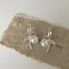 Nuevos Pendientes 2025 Estilo Japonés y Coreano Lazo Dulce Perla de Imitación Pendientes de Lujo Ligero Joyería de Moda Versátil Venta al por Mayor