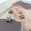 Suministro directo botón metálico de estrella de cinco puntas retro botón pequeño fragancia estilo europeo y americano suéter abrigo abrigo de cuero accesorios de joyería
