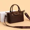Bolsa tipo dumpling de color block de comercio exterior para mujer, nuevo modelo 2026, bolso de hombro casual versátil, bolso de mano texturizado para ir al trabajo y uso cruzado