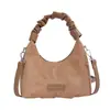 Bolso retro único de ante esmerilado para mujer, nuevo bolso cruzado versátil invierno 2026, bolso de mano pequeño exquisito