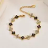 Pulsera de trébol de cuatro hojas estilo francés transfronteriza europea y americana, lujo ligero con un toque de alta gama, llena de piedras de circonita, joyería de acero inoxidable
