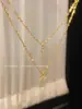 Nuevo collar cruz de doble capa estilo coreano de nicho 2023 cadena para la clavícula de circonita