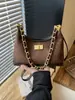 Bolso de hombro cruzado acolchado con cadena estilo Chanel para mujer, moda coreana de nicho, bolso de hombro y bandolera simple