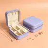 Caja de joyería portátil de stock de fábrica, caja de exhibición de accesorios de gran capacidad con espejo, caja de almacenamiento para aretes de oro, anillos y collares