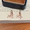 Pendientes Europeos y Americanos Más Vendidos de Doble Cruz de Circonita Super Brillantes, Lujo Ligero, Diseño de Alta Gama, Pendientes Exquisitos y Elegantes