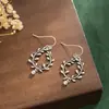 Hermosos aretes personalizados simples para mujer estilo retro étnico flor hueca floreciendo ricos aretes de rama de olivo aretes al por mayor
