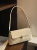 Bolso tipo baguette de nicho para mujer 2026 nuevo estilo moderno versátil celebridad de internet de moda bolso de axila estilo francés de alta gama bolso de un solo hombro