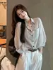 Camisa protectora solar retro a rayas estilo francés para mujer, nuevo diseño casual fino de verano 2026, camisa holgada de manga larga
