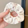 Copa de la cabeza femenina intestino grueso liga para el pelo linda cuerda para el pelo flor de pelo de ambiente accesorios para el pelo estilo coreano artístico alta elasticidad encaje moño liberación