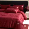 Set de regalo de alta gama de algodón de fibra larga jacquard rojo brillante de cuatro piezas para boda, colcha y ropa de cama de algodón puro para boda