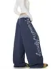 Pantalones casuales de retazos con estampado de letras desgastado estilo retro americano, unisex streetwear holgados de pierna ancha con pierna curva