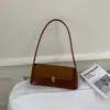 Bolsa de ombro vintage de nicho com toque de luxo, bolsa de mão de cor sólida de ombro único para o trabalho, bolsa feminina versátil e estilosa para exportação