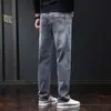 Jeans para hombre 2026 nueva marca de moda talla grande sueltos rectos largos elásticos versátiles pantalones casuales ropa de hombre
