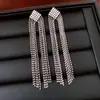 Pendientes de borla con flor de trébol de circonita vintage con un toque de alta gama, pendientes versátiles y de moda al por mayor