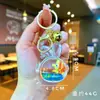 Llavero Creativo Serie Océano Relleno de Aceite Pez Payaso Estrella de Mar Pez Pequeño Colgante de Bolso Decoración de Llavero