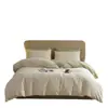 Juego de cuatro piezas de algodón puro cepillado de lujo ligero para otoño e invierno, juego de ropa de cama de tres piezas de color liso bicolor de algodón cálido y grueso