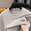Camiseta base de mezcla de lana para hombre de primavera y otoño, venta al por mayor multicolor, camiseta de manga larga con cuello redondo de lujo ligero, estilo business casual para hombre