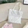 65291 Bolsa de Lona Bordada Branca Leite Textura Macia Leve Bolsa de Ombro Versátil para Viagem de Menina Artística