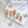 Nuevas joyas para uñas al por mayor lazo brillante hueco ojo de gato tridimensional combinan con todo para usar accesorios de decoración de uñas
