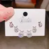 Exquisitos aretes de botón de zirconia con forma de lazo y cruz, finamente elaborados, de alta gama, juego de tres pares, juego de aretes de moda con pasador de plata para mujer