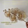 Simulación Flor de Año Nuevo Eucalipto Dorado Hoja de Ginkgo Flor de Plástico Cubeta de Año Nuevo Arreglo Floral de Phalaenopsis Combinación Dorada