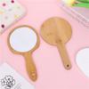 Comercio electrónico transfronterizo orejas de gato creativas espejo de maquillaje portátil de bambú dormitorio de estudiante espejo de mano estilo coreano chica sosteniendo regalo