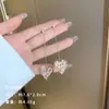 Exquisitos pendientes largos cortos con borlas incrustados de perlas y diamantes para mujer diseño de nicho de lujo ligero pendientes de lazo amor