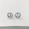 Joyería hecha a mano al por mayor transfronteriza, aretes de perlas DIY, soportes vacíos para aretes, aretes de girasol clásicos, accesorios versátiles