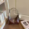 Bolsa feminina Shuai Mi Jia 2026 outono inicial nova bolsa vintage de ombro sob o braço bolsa transversal de alto valor para o dia a dia