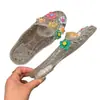 Zapatos de gelatina de moda para mujer, estilo coreano, zapatos destalonados con accesorios florales, medios zuecos planos, chanclas de playa transparentes de cristal